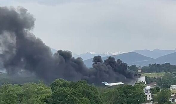 Geneva airport fire: Black smoke rises from hangar as massive building erupts in flames